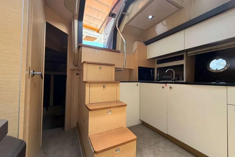 Slide: The Image of Interior cabin of 2013 Cranchi Endurance 41 yacht, featuring modern wood cabinetry. - 15
