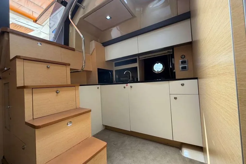 Slide: The Image of Interior cabin of 2013 Cranchi Endurance 41 yacht with twin beds and cozy decor. - 16