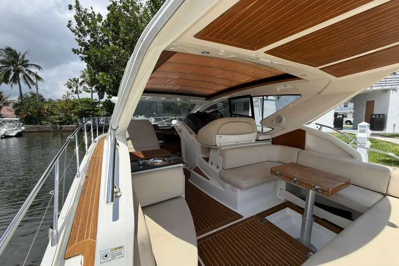 Slide: The Image of Luxurious interior of 2013 Cranchi Endurance 41 yacht with elegant seating and wooden accents. - 2