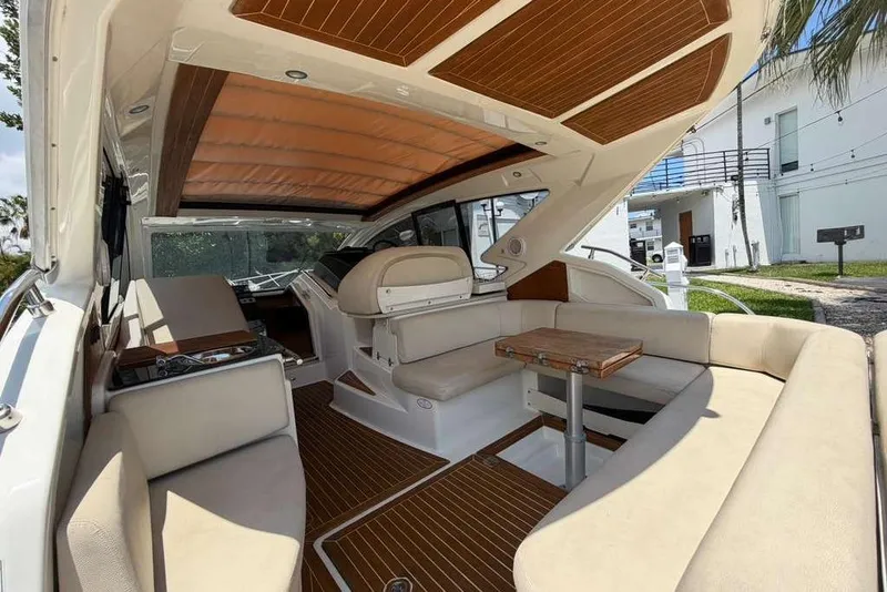 Slide: The Image of Interior of 2013 Cranchi Endurance 41 yacht with beige seating and wooden accents. - 3