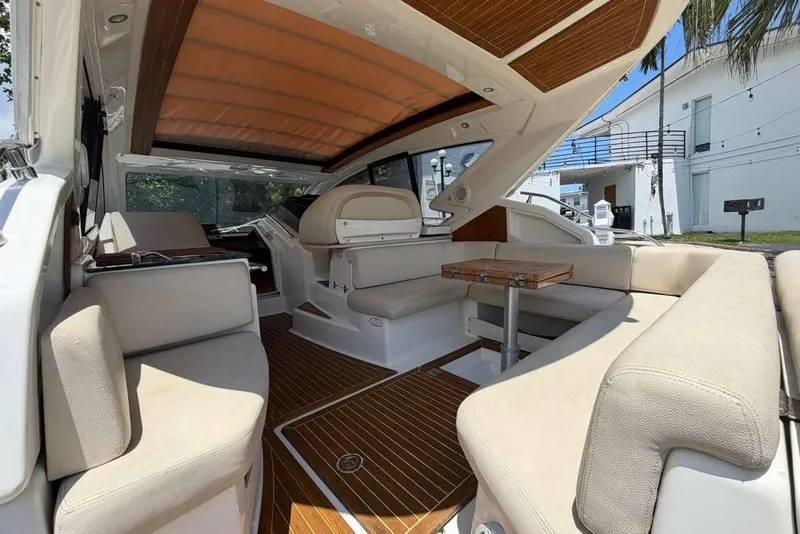 Slide: The Image of Interior of 2013 Cranchi Endurance 41 yacht with beige seating and wooden accents. - 4