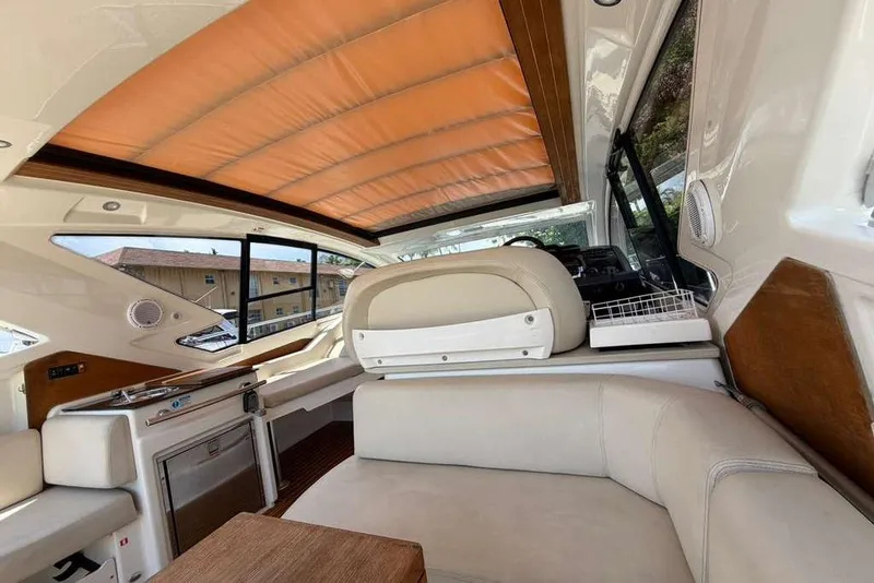 Slide: The Image of Interior of 2013 Cranchi Endurance 41 yacht with helm and beige seating. - 5