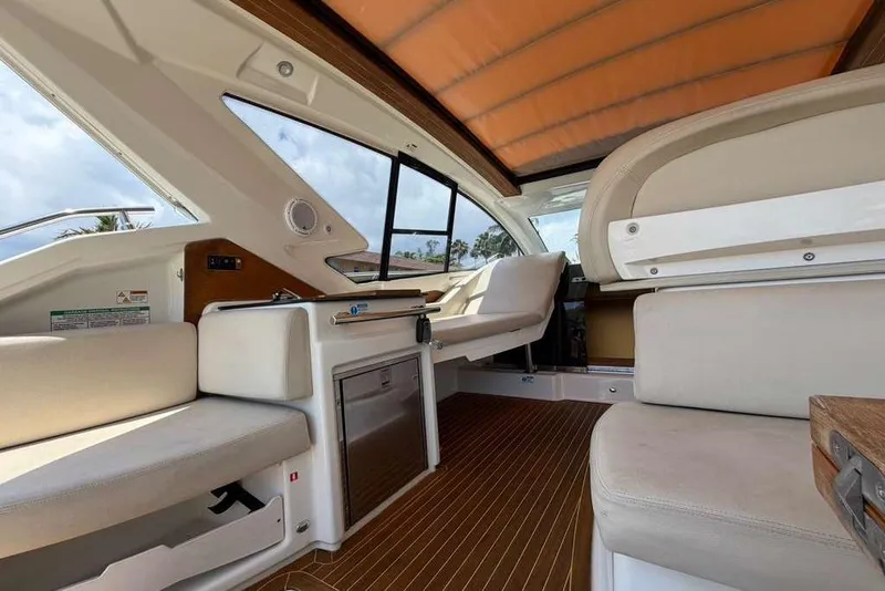 Slide: The Image of Control panel of a 2013 Cranchi Endurance 41 boat with steering wheel and navigation equipment. - 7