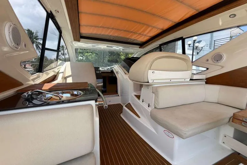 Slide: The Image of Interior of 2013 Cranchi Endurance 41 yacht with tan seating and modern helm. - 8