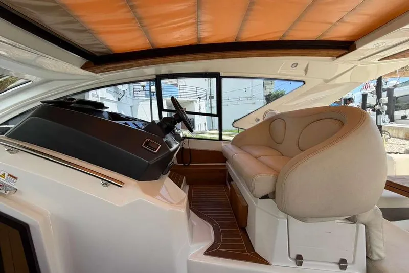 Slide: The Image of Interior view of 2013 Cranchi Endurance 41 yacht cockpit with leather seating. - 9