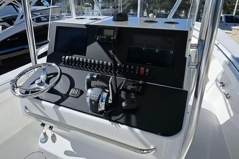 Slide: The Image of 2007 SeaCraft SC32 Master Angler boat console with steering wheel and navigation controls. - 12