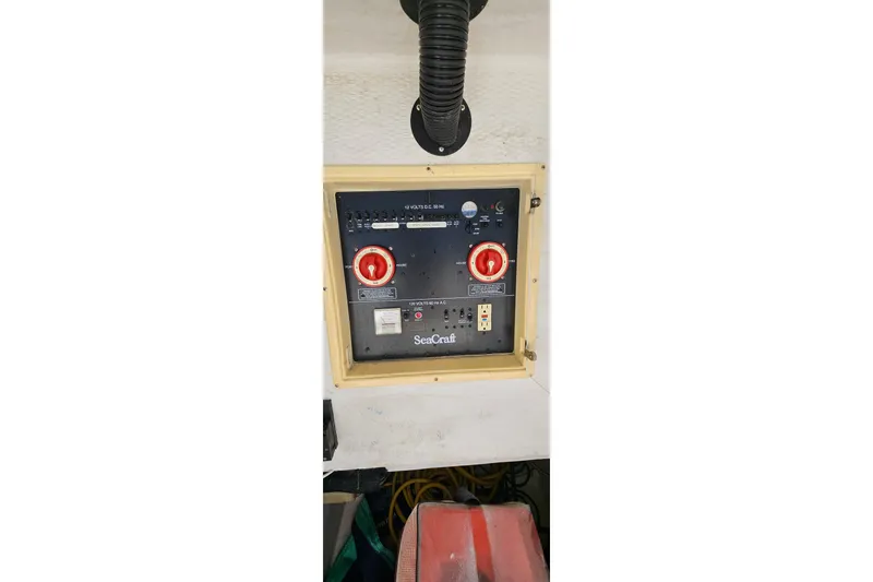 Slide: The Image of Control panel of 2007 SeaCraft SC32 Master Angler boat with red switches and labels. - 17