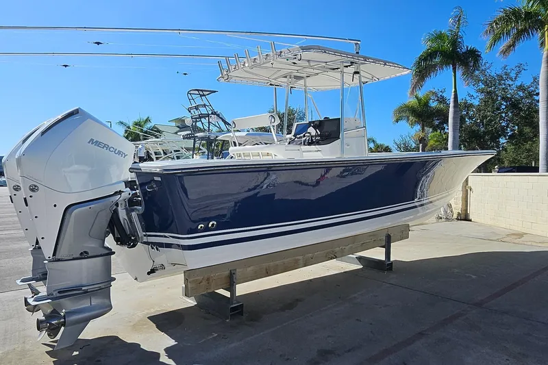 Slide: The Image of 2007 SeaCraft SC32 Master Angler boat with Mercury engine, docked under clear blue sky. - 2