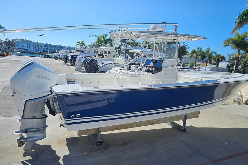 Slide: The Image of 2007 SeaCraft SC32 Master Angler boat with Mercury engine, docked under clear blue sky. - 4