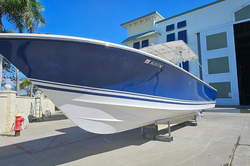 Slide: The Image of 2007 SeaCraft SC32 Master Angler boat on display outside a marina building. - 6