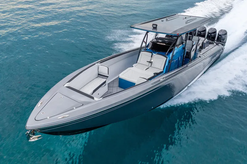 Slide: The Image of 2024 Nor-Tech 390 Sport Center Console cruising on clear blue water. - 21