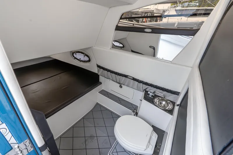 Slide: The Image of 2024 Nor-Tech 390 Sport Center Console cabin with modern amenities and sleek design. - 25