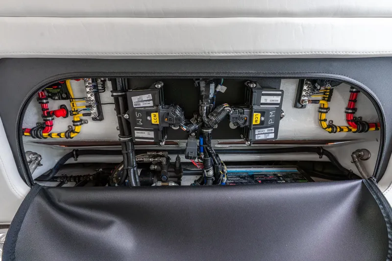 Slide: The Image of Electrical components inside a 2024 Nor-Tech 390 Sport Center Console boat. - 28