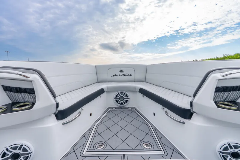 Slide: The Image of 2024 Nor-Tech 390 Sport Center Console boat interior with sleek seating and modern design. - 31