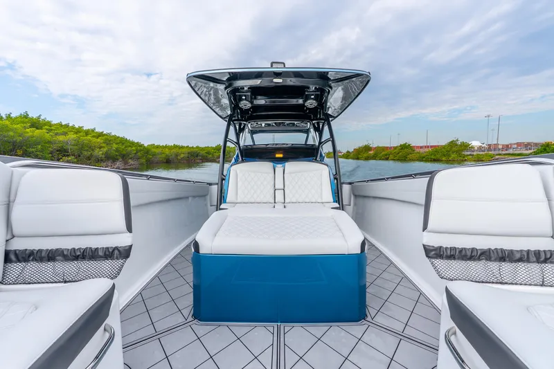 Slide: The Image of 2024 Nor-Tech 390 Sport Center Console boat interior with luxurious seating and sleek design. - 33
