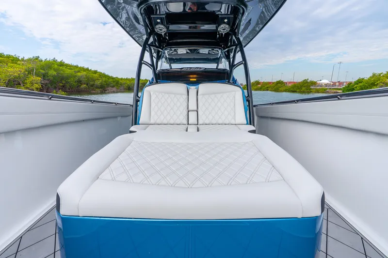 Slide: The Image of 2024 Nor-Tech 390 Sport Center Console with luxurious seating and sleek design. - 34