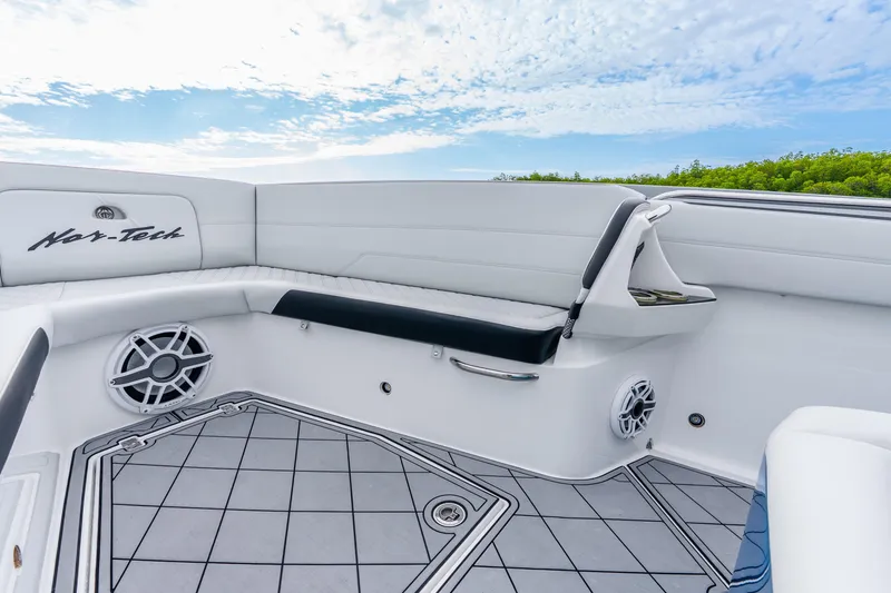 Slide: The Image of 2024 Nor-Tech 390 Sport Center Console interior with sleek seating and modern design. - 35