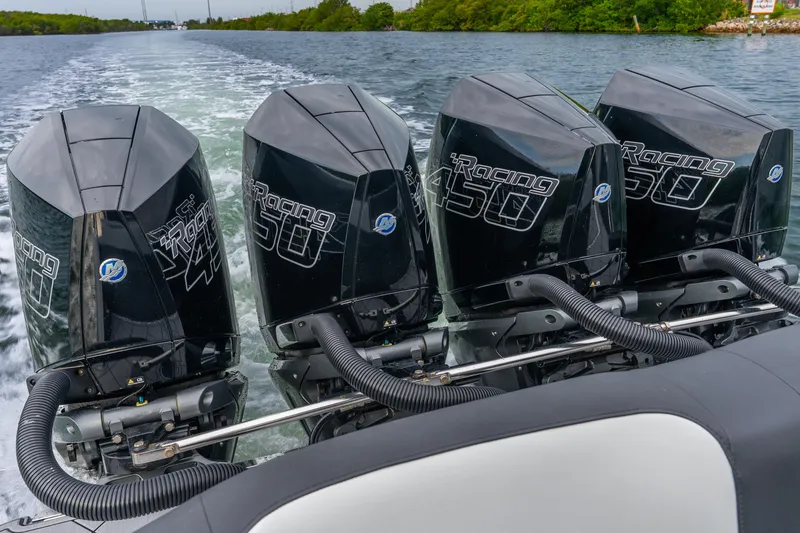 Slide: The Image of 2024 Nor-Tech 390 Sport Center Console with quad Mercury Racing 450 engines on water. - 42