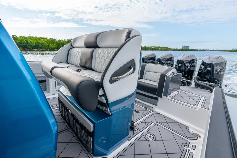 Slide: The Image of 2024 Nor-Tech 390 Sport Center Console with luxurious seating and powerful engines. - 45