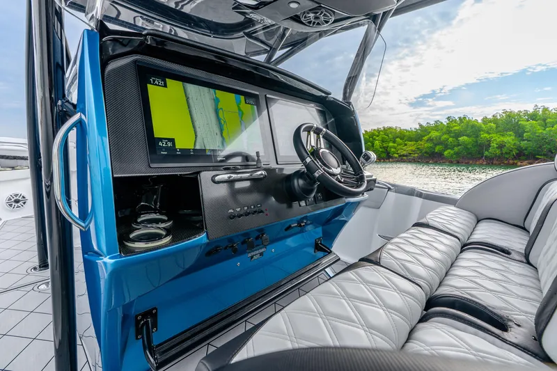 Slide: The Image of 2024 Nor-Tech 390 Sport Center Console interior with advanced navigation system and luxurious seating. - 47