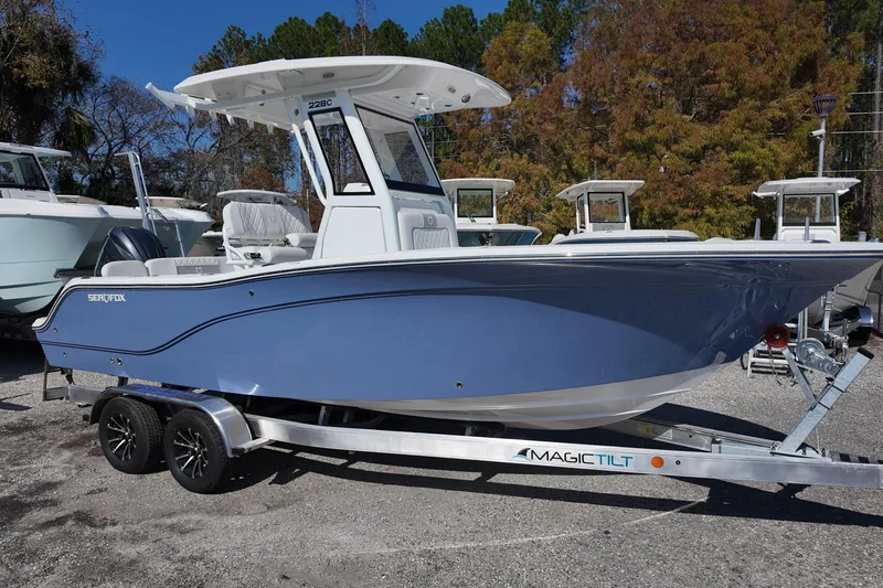 The Image of 2026 Sea Fox 228 Commander boat on trailer, parked outdoors. - 0