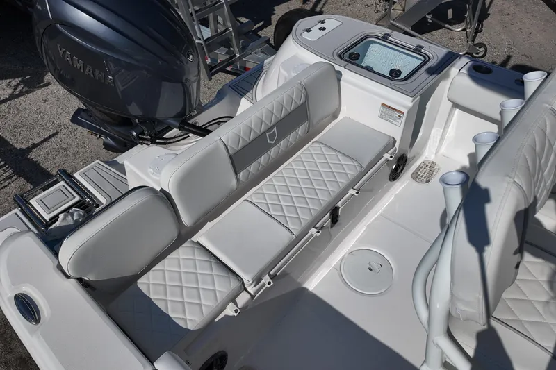 Slide: The Image of 2026 Sea Fox 228 Commander boat interior with cushioned seating and Yamaha engine. - 13