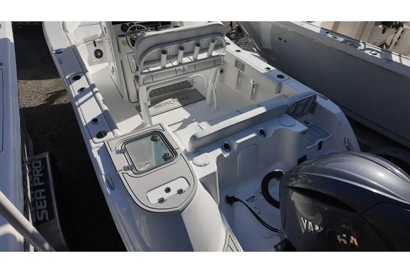 Slide: The Image of 2026 Sea Fox 228 Commander boat interior with Yamaha engine, showcasing seating and storage. - 14