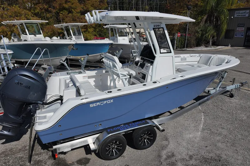 Slide: The Image of 2026 Sea Fox 228 Commander boat on trailer, featuring Yamaha engine, in outdoor setting. - 4
