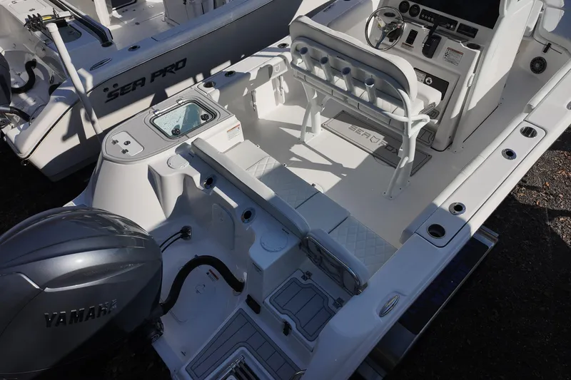 Slide: The Image of 2026 Sea Fox 228 Commander boat interior with Yamaha engine, featuring seating and control console. - 5