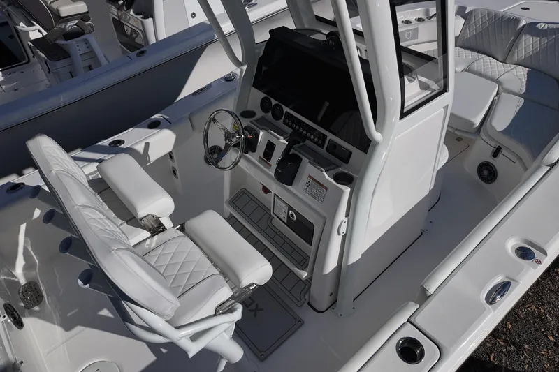 Slide: The Image of 2026 Sea Fox 228 Commander boat interior with steering console and seating. - 6