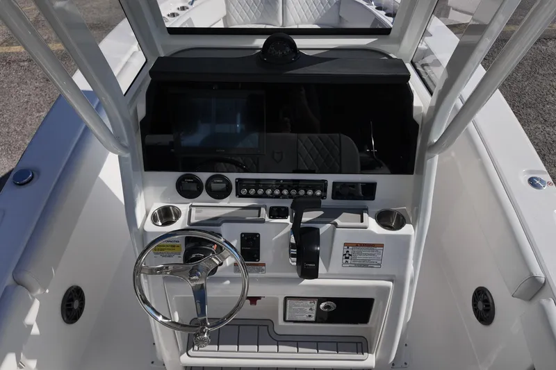 Slide: The Image of 2026 Sea Fox 228 Commander boat dashboard with steering wheel and controls. - 7