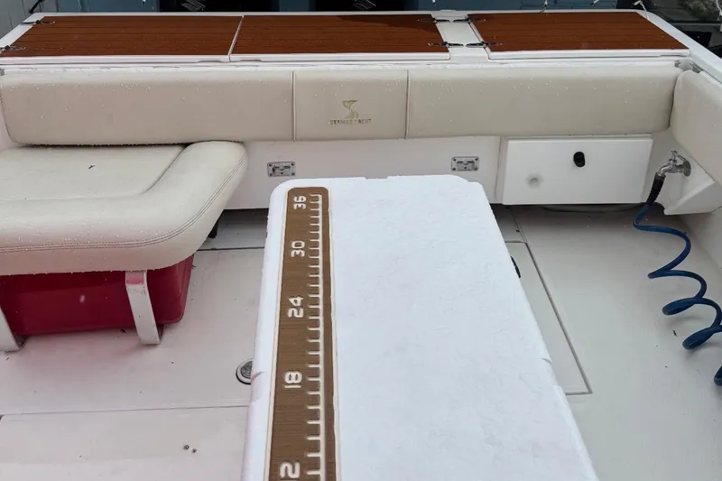 Slide: The Image of Cozy cabin interior of a 2004 Stamas 290 Express boat with plush bedding and decor. - 7