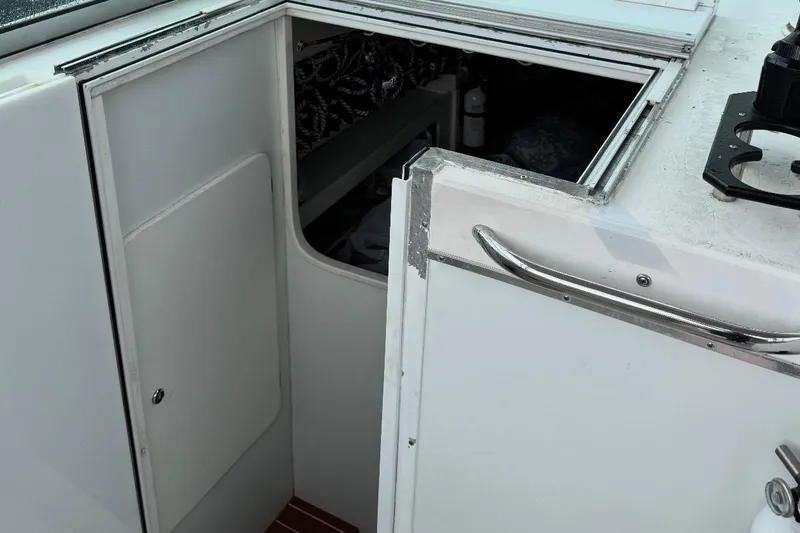 Slide: The Image of 2004 Stamas 290 Express boat kitchenette with sink and coffee maker. - 8