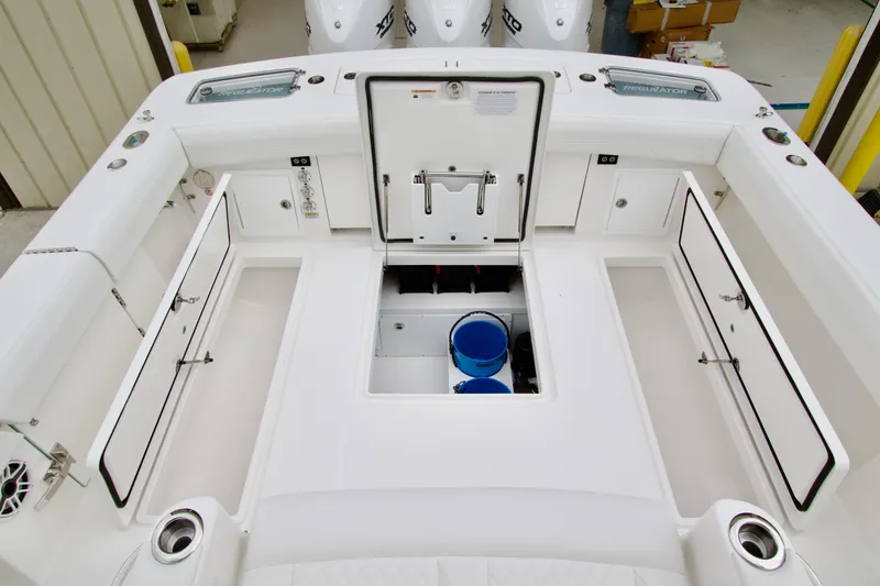 Slide: The Image of 2026 Regulator 37 boat deck with storage compartments and fishing equipment. - 11