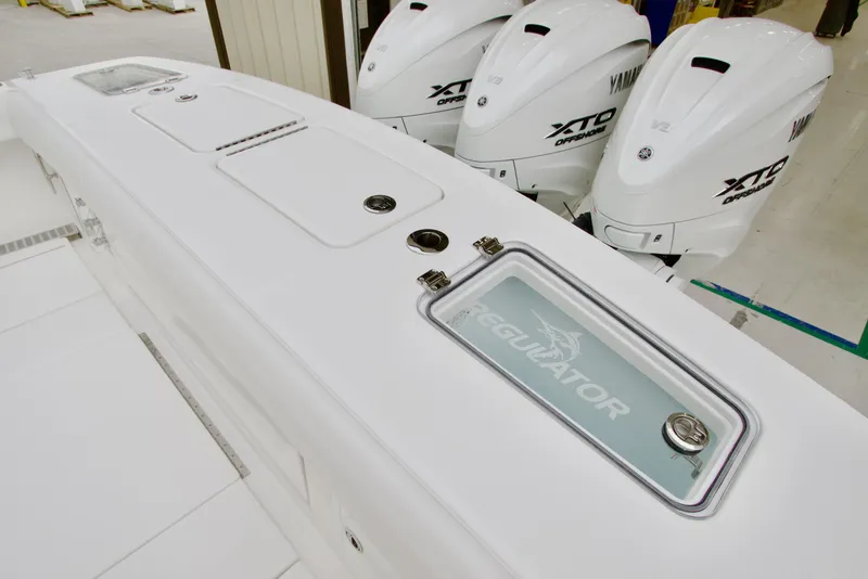 Slide: The Image of 2026 Regulator 37 boat with Yamaha XTO engines, featuring sleek white design. - 12