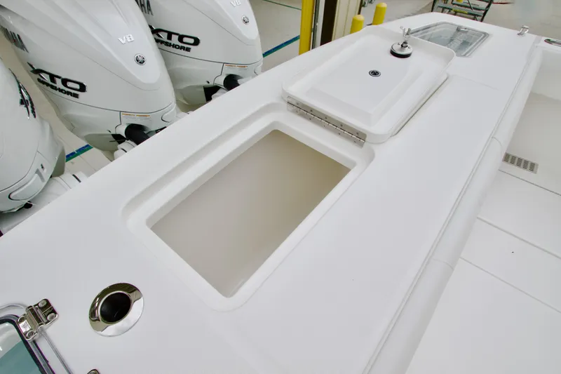 Slide: The Image of 2026 Regulator 37 boat deck with Yamaha V8 engines and storage compartments. - 13