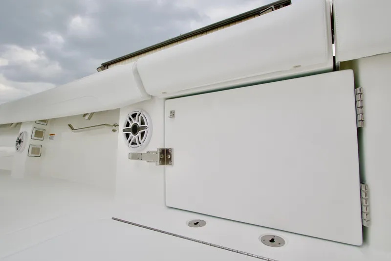 Slide: The Image of 2026 Regulator 37 boat interior with storage compartment and speaker. - 14