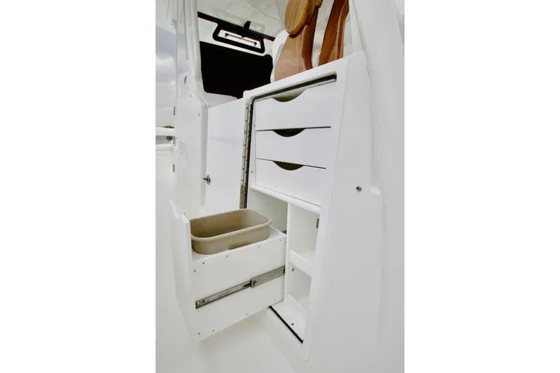 Slide: The Image of 2026 Regulator 37 boat interior storage with open drawers and compartments. - 19