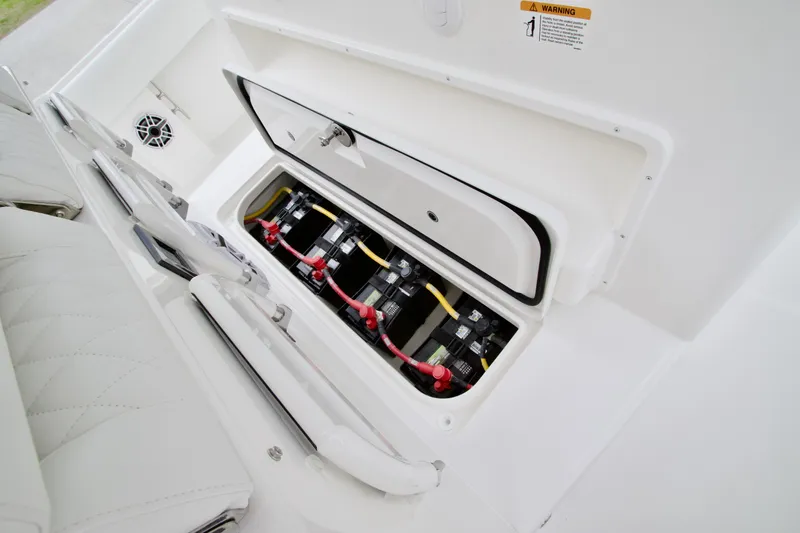 Slide: The Image of 2026 Regulator 37 boat battery compartment with multiple batteries and wiring. - 23