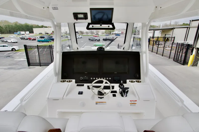 Slide: The Image of 2026 Regulator 37 boat cockpit with modern steering and navigation controls. - 26