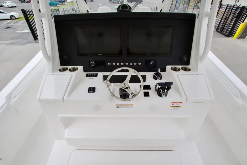 Slide: The Image of Helm of 2026 Regulator 37 boat with modern controls and dual screens. - 28