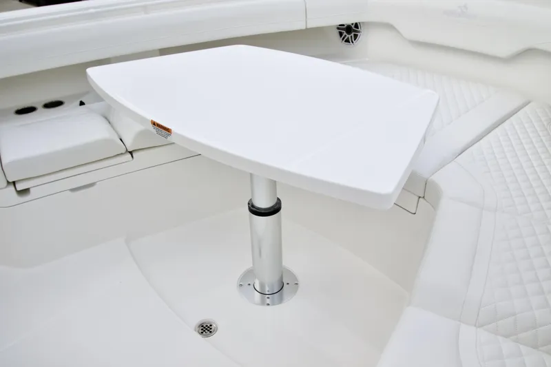 Slide: The Image of Luxury seating area with table on 2026 Regulator 37 boat. - 31