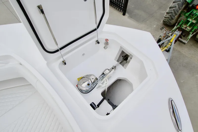 Slide: The Image of Open anchor compartment on 2026 Regulator 37 boat, showcasing anchor storage and mechanism. - 32