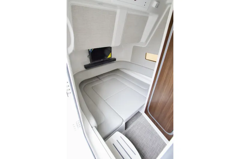 Slide: The Image of 2026 Regulator 37 cabin interior with modern seating and wood accents. - 37