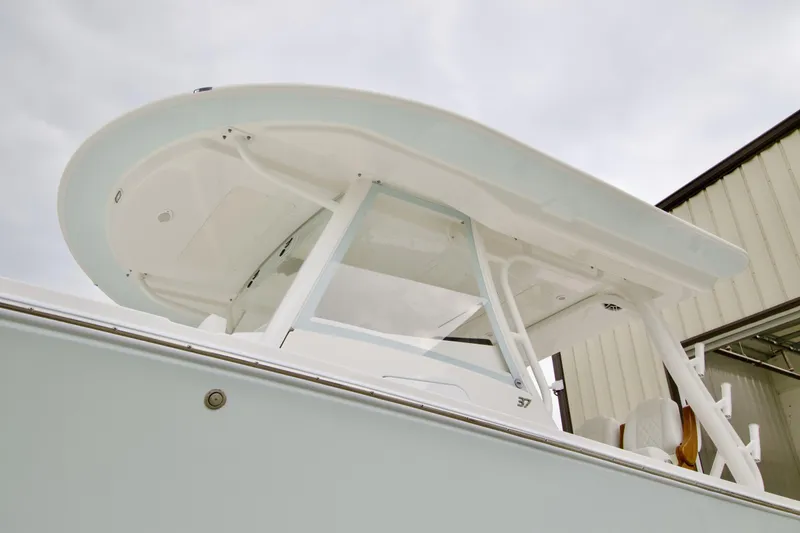 Slide: The Image of 2026 Regulator 37 boat with sleek white hardtop and modern design. - 4