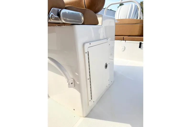 Slide: The Image of 2023 Sea Hunt Ultra 255 SE boat interior with storage compartment and seating. - 11