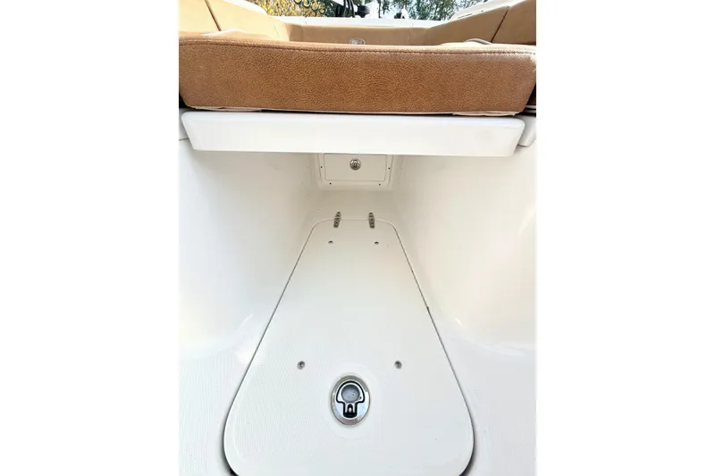 Slide: The Image of 2023 Sea Hunt Ultra 255 SE boat interior storage compartment. - 22