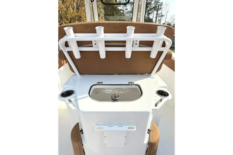 Slide: The Image of 2023 Sea Hunt Ultra 255 SE boat interior with rod holders and storage compartment. - 27