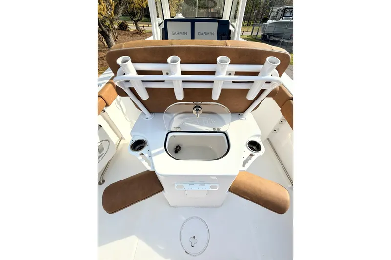Slide: The Image of 2023 Sea Hunt Ultra 255 SE boat interior with rod holders and sink. - 28