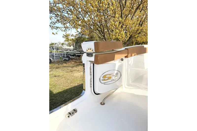 Slide: The Image of 2023 Sea Hunt Ultra 255 SE boat interior with cushioned seating and logo detail. - 4